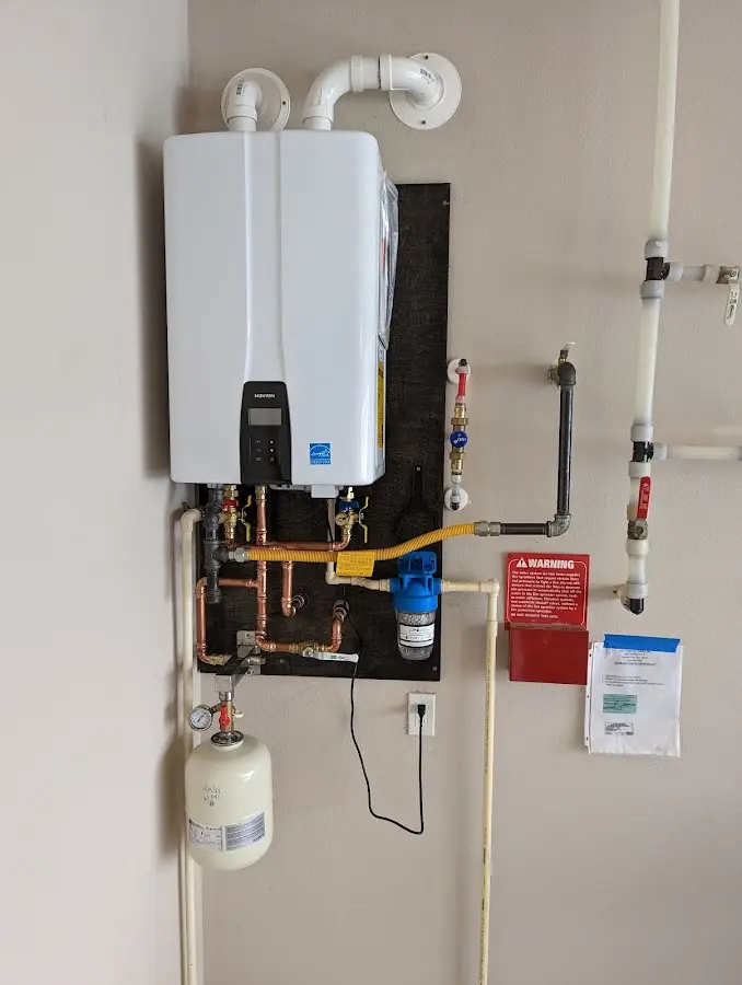 Professional plumber installing copper piping in a Chagrin Falls home